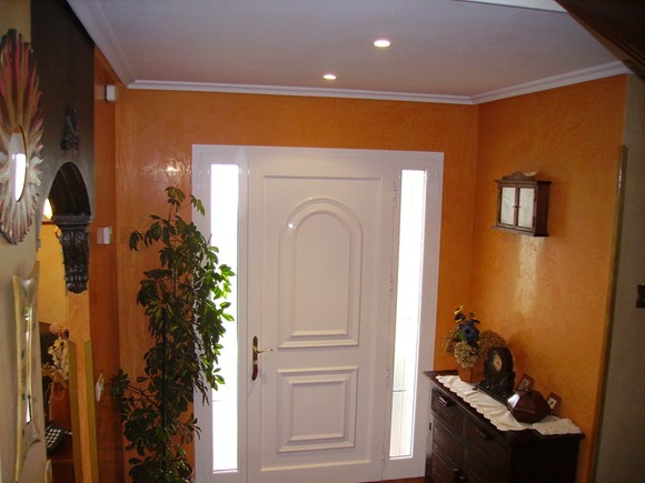 Aplicación de estuco veneciano color naranja